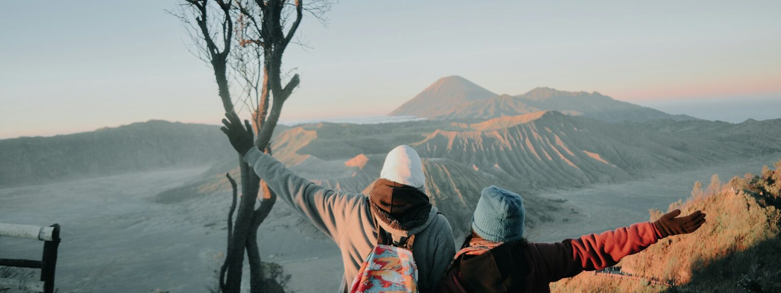 two person looking at mountains