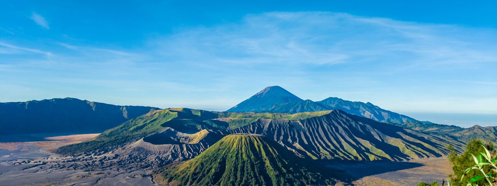 green and brown mountain under blue sky during daytime