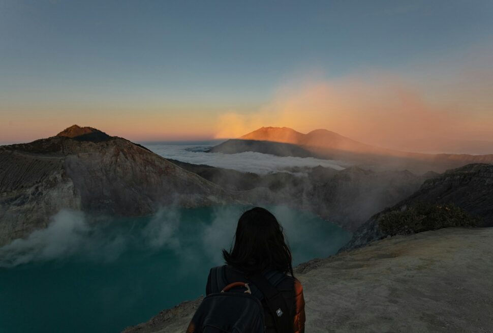 woman standing beside lake